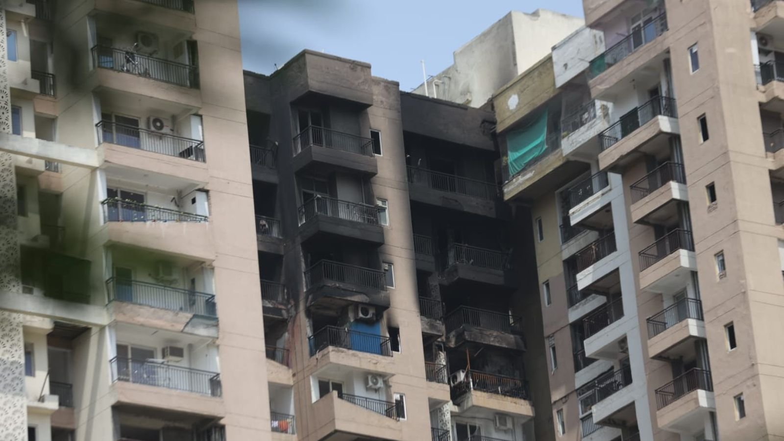 Sleeping family escapes as AC blast sparks fire in 21st-floor Noida flat